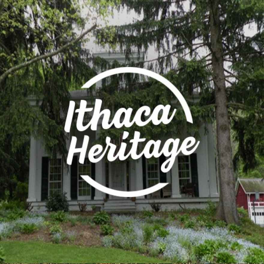 Circular text area that reads ”Ithaca Heritage” overlaid over an image of a home with greek architectural style.