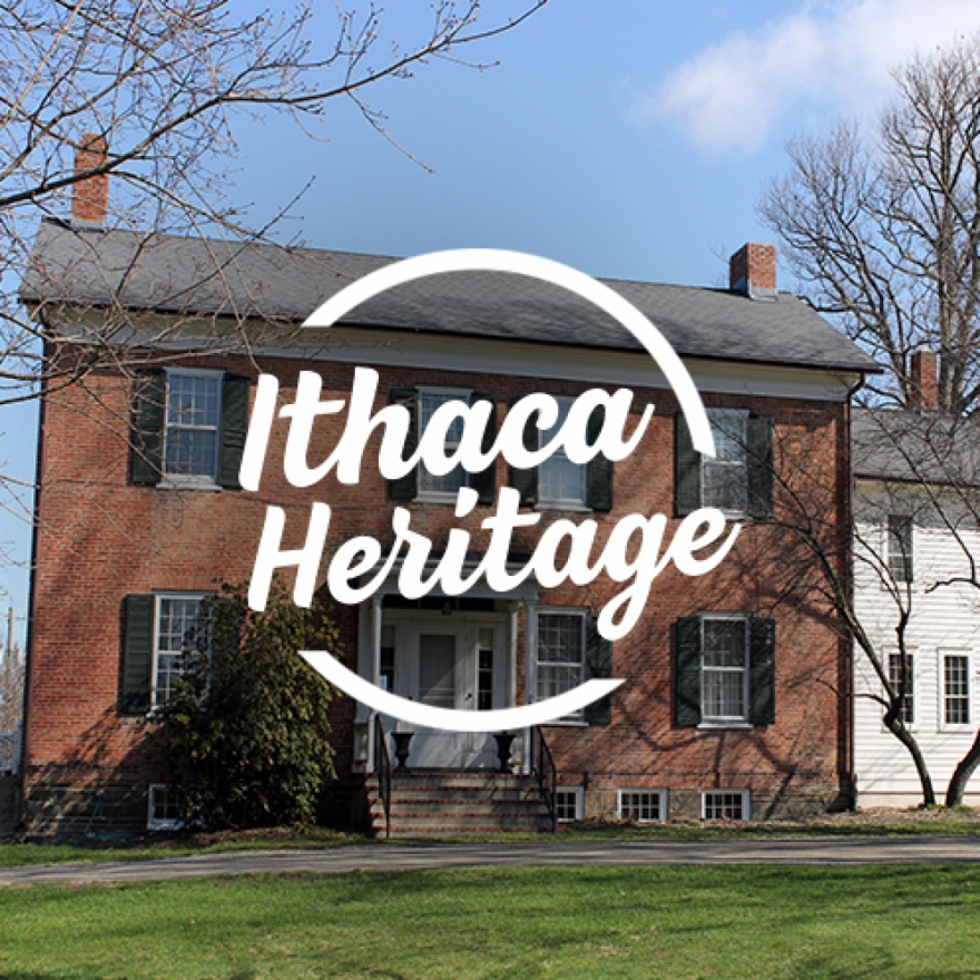 Circular text area that reads ”Ithaca Heritage” overlaid over an image of the southworth homestead.