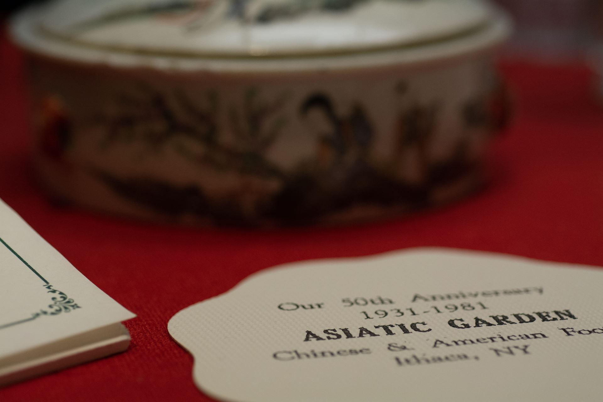 A small rectangular image of a label from an exhibit that reads "Our 50th Anniversay 1931-1981 ASIATIC GARDEN Chinese & American ... Ithaca. NY"