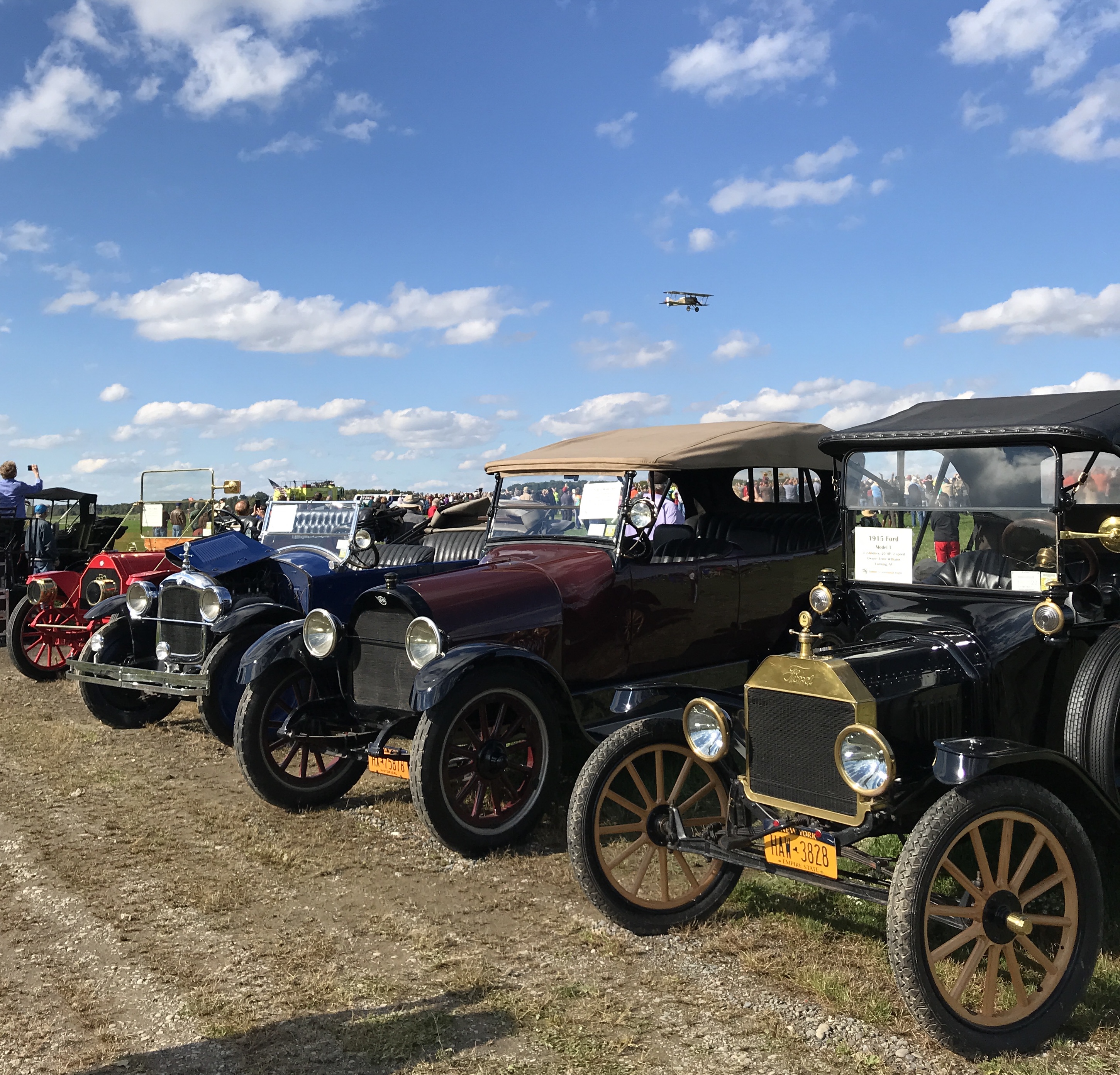 A image of several vintage cars in a line.
