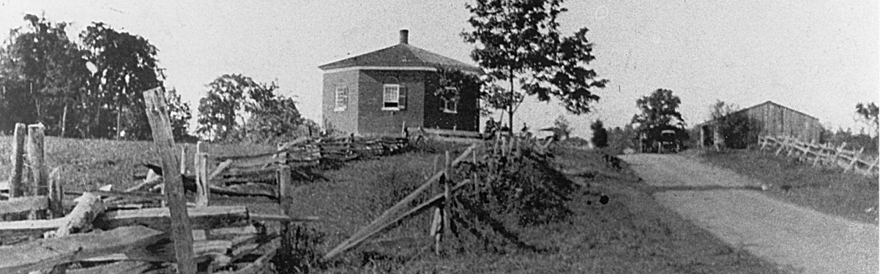 A rectangular black and white image of the Eight Square Schoolhouse.